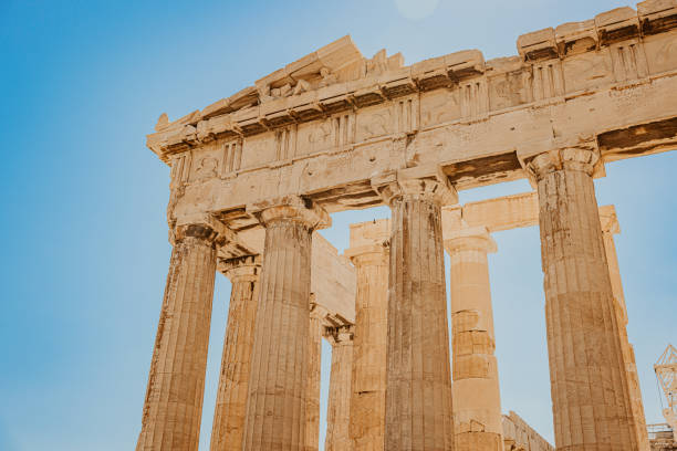 Low angle view of beautiful ancient Parthenon temple against clear sky during sunny day