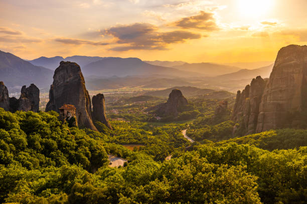 Scenic view of Meteora monastery against cloudy sky during sunset Scenic view of famous Meteora monastery against cloudy sky during sunset meteora stock pictures, royalty-free photos & images