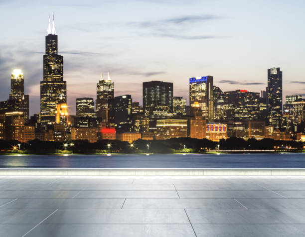 Empty concrete embankment on the background of a beautiful blurry Chicago city skyline at evening, mockup stock photo