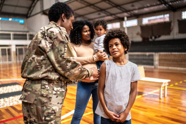 istock Soldier vaccinating a boy at a community center 1432209139