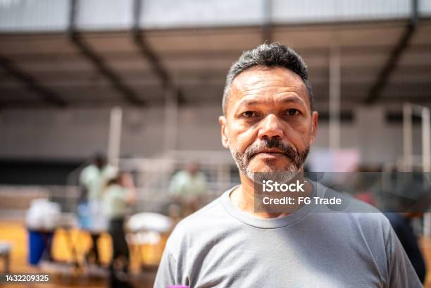 Portrait Of A Mature Man At A Community Center Stock Photo - Download Image Now - Portrait, Homelessness, People