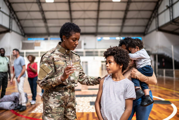 istock Soldier vaccinating a boy at a community center 1432209354
