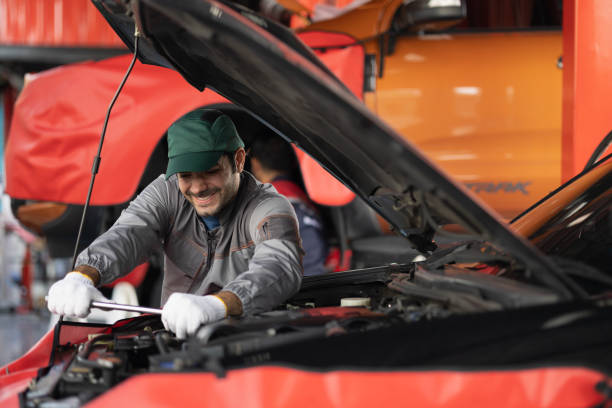 istock Automobile mechanic man checking car damage broken part condition. diagnostic and repairing vehicle at garage automotive, Concepts of car care check and fixed and services insurance. 1432209675