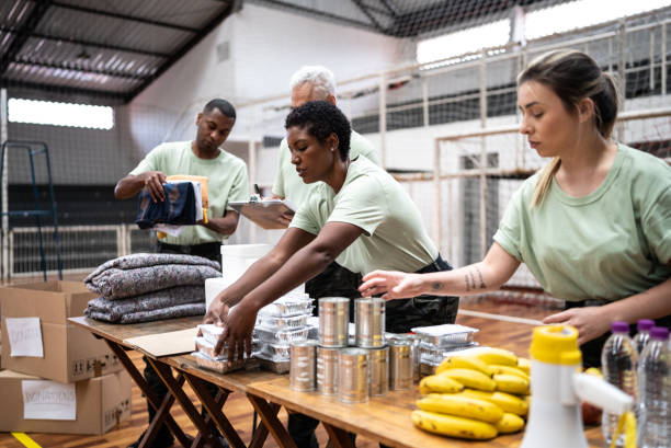 Soldiers organizing donations at a gymnasium Soldiers organizing donations at a gymnasium humanitarian aid stock pictures, royalty-free photos & images