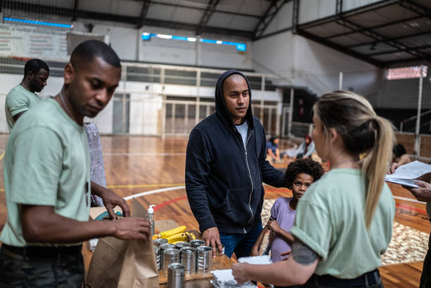 istock Man and daughter receiving donation in a sheltering 1432210950