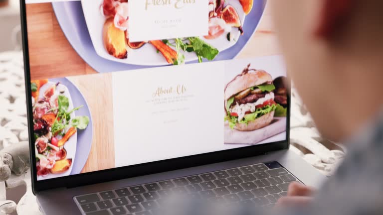 Restaurant, web design and computer food website of a man scroll through about us website work. IT, ux and webdesign worker with technology to check digital marketing and ui internet screen display