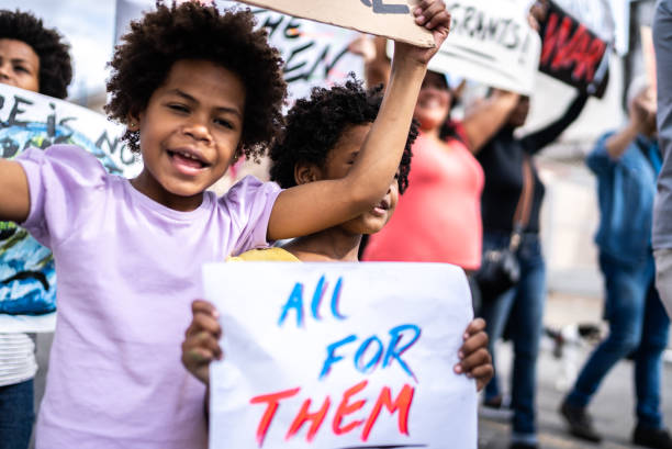 istock Children protesting in the street 1432211956