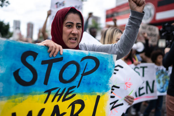 Mature woman protesting in the street