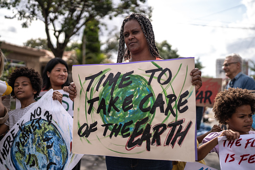 Mature woman protesting in the street