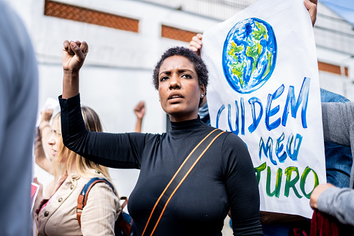 Brazilian environmentalists protesting about planet earth outdoors