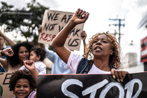 Senior woman protesting in the street