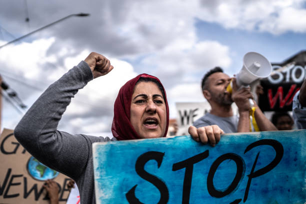 istock People protesting in the street 1432212170