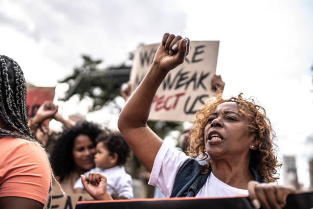 Senior woman protesting in the street