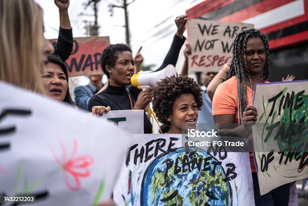 People Protesting In The Street Stock Photo - Download Image Now - Climate Activist, Adult, Climate Justice