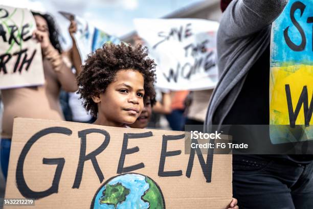 Boy Protesting In The Street Stock Photo - Download Image Now - 8-9 Years, Activist, African Ethnicity