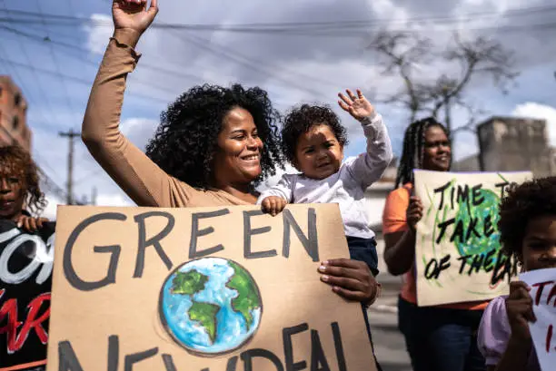 Young woman with her son protesting in the street