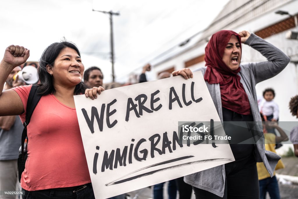 Refugee woman protesting in the street Immigrant Stock Photo