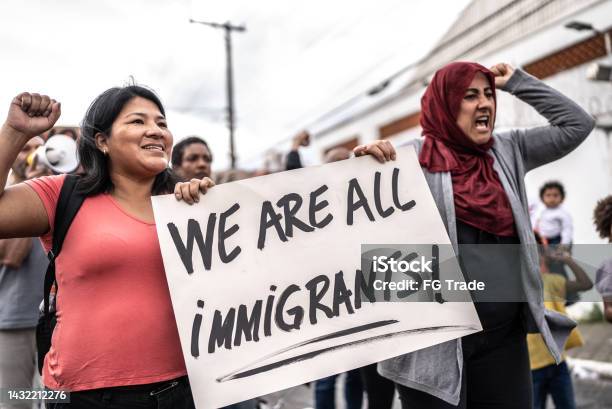 Refugee Woman Protesting In The Street Stock Photo - Download Image Now - Immigrant, USA, Protest