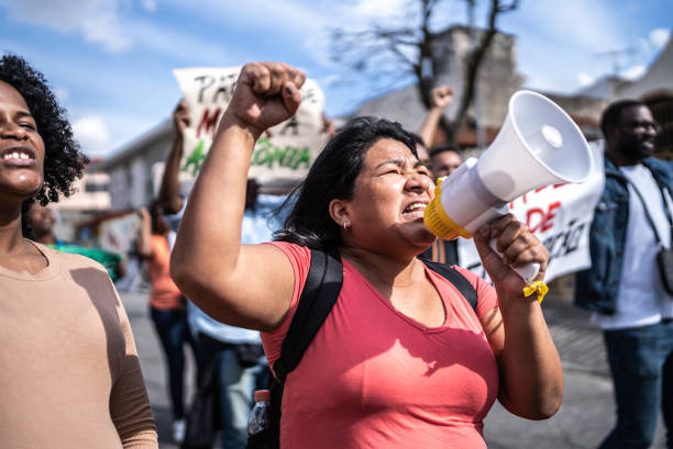 istock Group of people protesting in the streets 1432213256