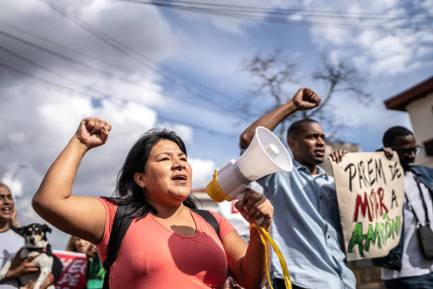 istock Group of people protesting in the streets 1432213258
