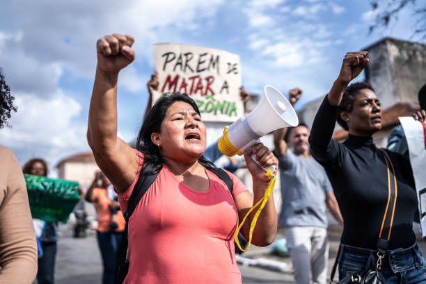 istock Group of people protesting in the streets 1432213293