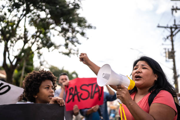 istock Group of people protesting in the streets 1432213397