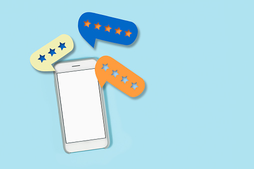 Mobile phones on a blue background with star rating around them
