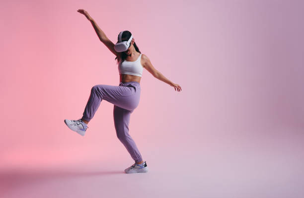 istock Active young woman having fun in the metaverse 1432215667