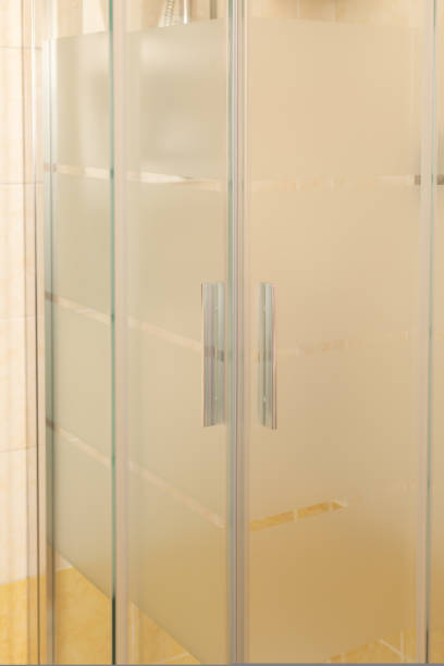 istock Chrome handles in a glass shower door. Modern bathroom interior. 1432216511