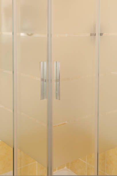 istock Chrome handles in a glass shower door. Modern bathroom interior. 1432216747
