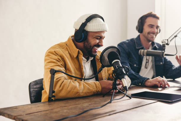 istock Two college podcasters having a good time in a studio 1432217008