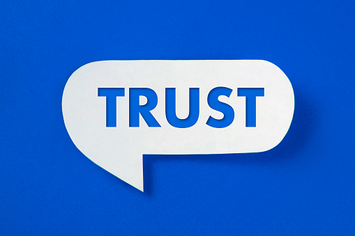 Speech bubble with trust text on blue background