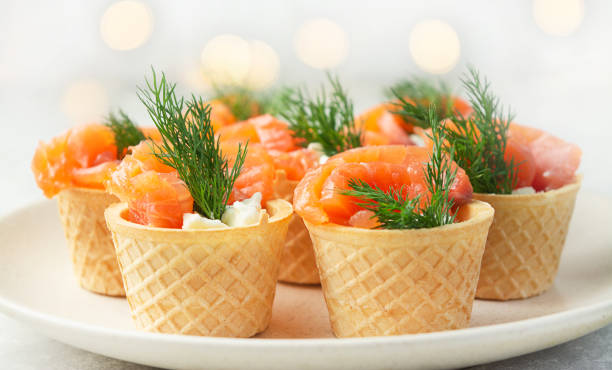 istock Snack with red fish on a plate. Festive snack. Menu for the festive table. Side view. Copy space. 1432219075