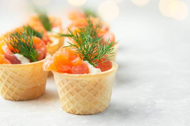 istock Snack with red fish on the table. Festive snack. Menu for the festive table. Side view. Copy space. 1432219086