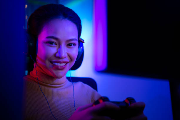 istock An active and serious young woman gamer on his powerful personal computer, playing first-person online video games. 1432220154