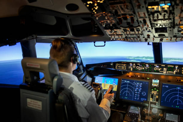 piloto masculino en cabina de avión jet - cockpit airplane aerospace industry control fotografías e imágenes de stock