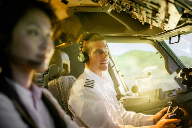 istock Pilot with co-pilot flying a commercial jet airplane 1432221816