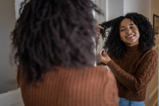 istock Handsome woman applying moisturizer to his face 1432221945