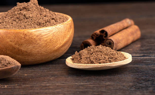istock Selective focus on ground cinnamon over wooden background. 1432223519