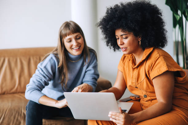 istock Businesswomen having a discussion while using a laptop in an office 1432226180