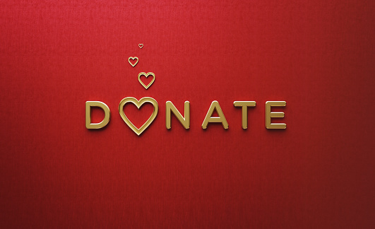 Gold colored heart shapes and donate word over red background. Horizontal composition with copy space.