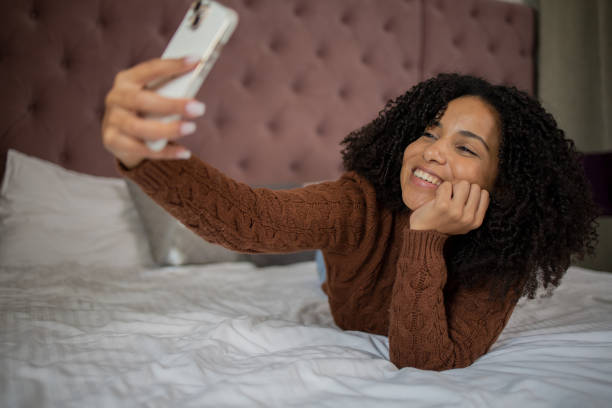 istock Happy young woman using phone 1432227243