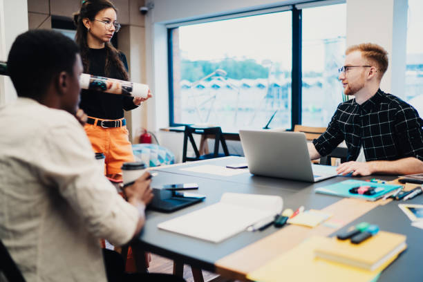 istock Creative multiracial colleagues working at coworking space 1432227261