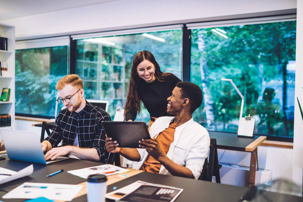 istock Cheerful diverse entrepreneurs planning startup project 1432227286
