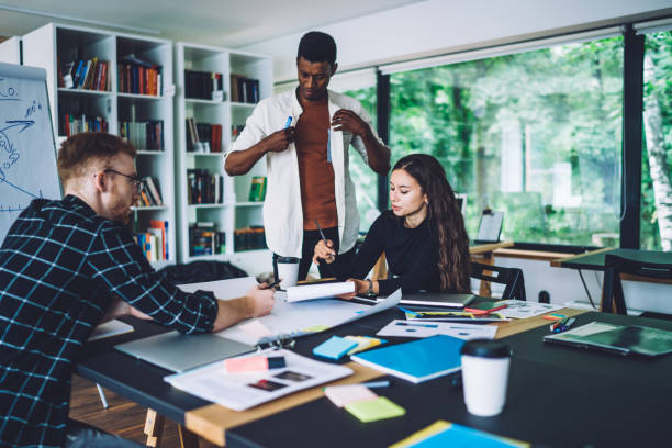 istock Young entrepreneurs brainstorming and working on business plan 1432227295