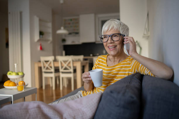 istock Happy senior woman using mobile phone 1432227990