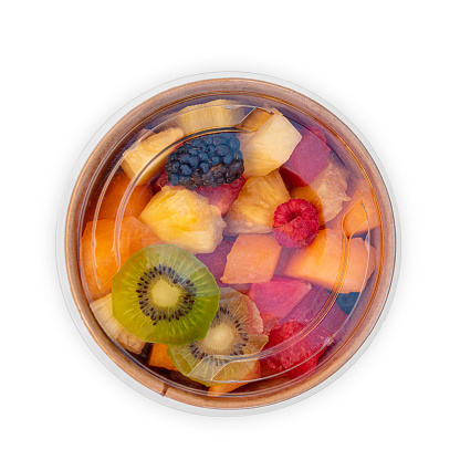 fruit salad in plastic box on white background