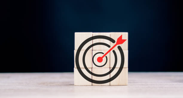 istock Objective and target concept. Arrow upward to target on wooden cubes. 1432231497