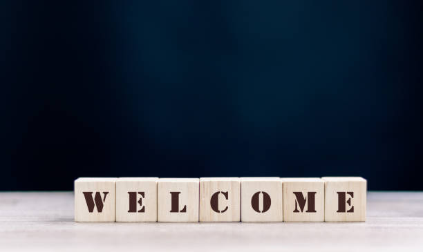 istock the word WELCOME is written on a wooden cubes structure. Cube on a bright background. Can be used for business, MEDICINE, financial concept. Selective focus. 1432231563