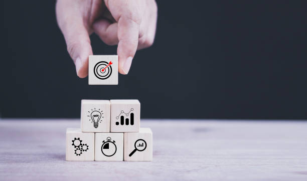 istock business strategy, Action plan, Goal and target, hand stack woods block step on table with icon about business strategy and Action plan. business development concept. copy space. 1432231585